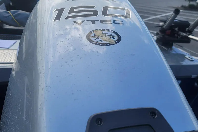 Slide: The Image of Close-up of a 2023 Fish Rite 210 Performer boat engine with 150 VTEC label. - 8