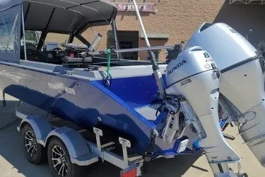 Slide: The Image of 2023 Fish Rite 210 Performer boat with Honda outboard motor on trailer. - 7