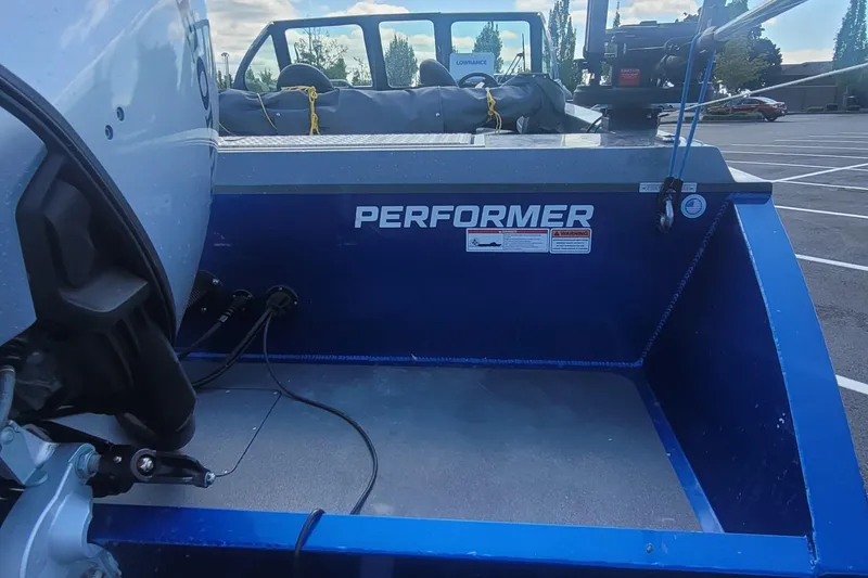 Slide: The Image of 2023 Fish Rite 210 Performer boat, rear view in a parking lot. - 10