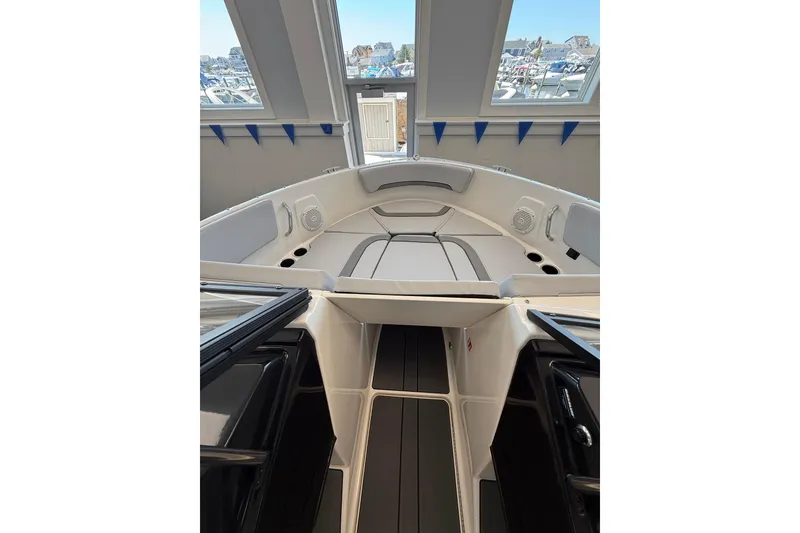 Slide: The Image of Interior view of 2026 Bayliner V22 boat, showcasing sleek seating and modern design. - 7
