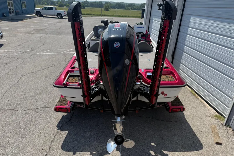 Slide: The Image of 2020 Bass Cat Pantera Classic boat with powerful outboard motor, parked outdoors. - 16