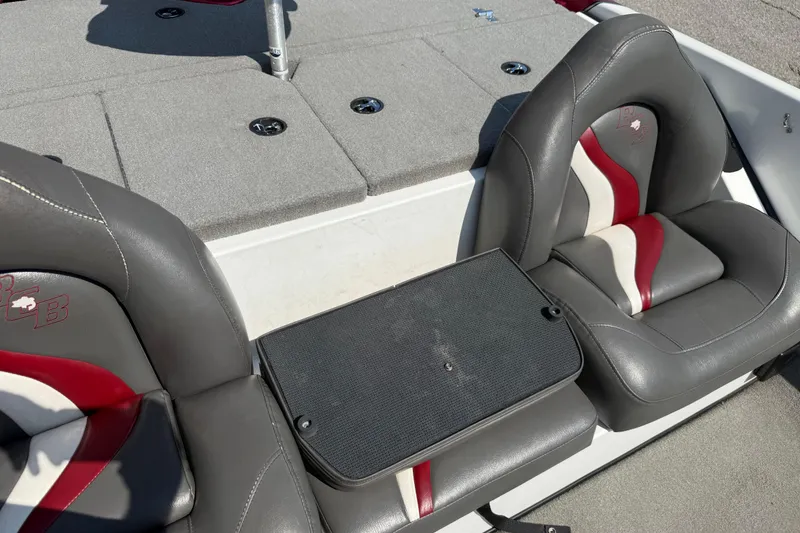 Slide: The Image of 2020 Bass Cat Pantera Classic boat interior with gray and red seating. - 42