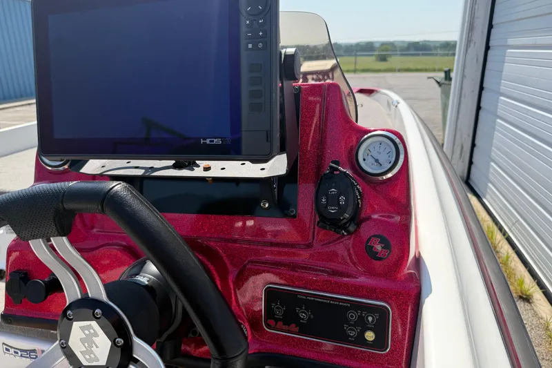 Slide: The Image of 2020 Bass Cat Pantera Classic dashboard with steering wheel and electronic display. - 37