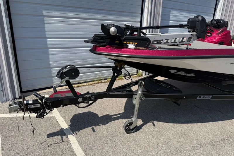 Slide: The Image of 2020 Bass Cat Pantera Classic boat on trailer, parked near storage units. - 21
