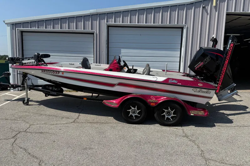 The Image of 2020 Bass Cat Pantera Classic boat parked outside a garage. - 13