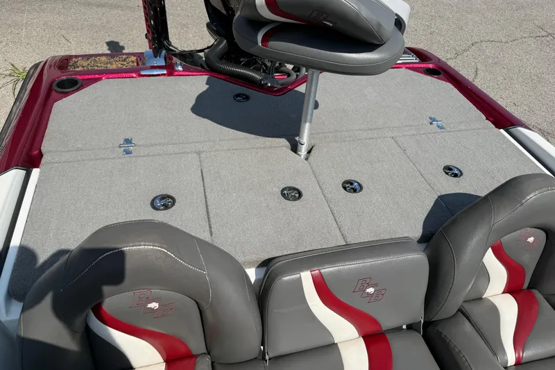 Slide: The Image of 2020 Bass Cat Pantera Classic boat interior with gray and red seating and carpeted deck. - 38