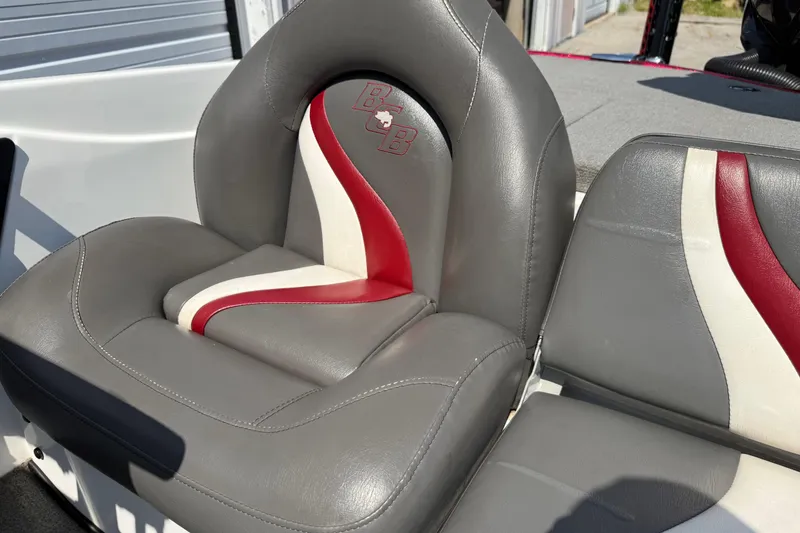 Slide: The Image of 2020 Bass Cat Pantera Classic boat seat with gray, red, and white design. - 33