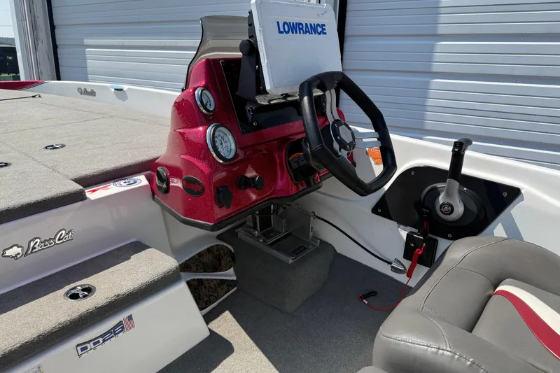 Slide: The Image of 2020 Bass Cat Pantera Classic boat dashboard with steering wheel and Lowrance electronics. - 35