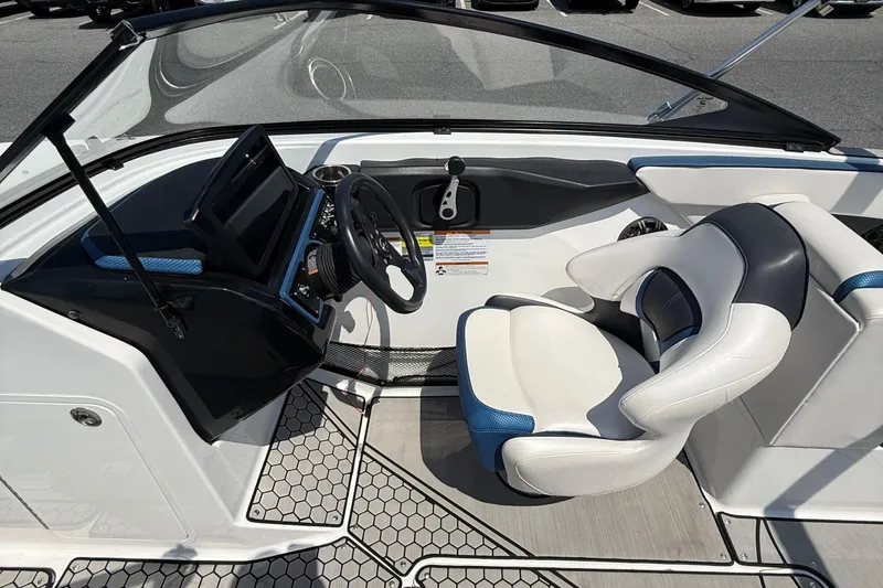 Slide: The Image of 2020 Scarab 255 Open ID boat cockpit with modern steering and comfortable seating. - 12