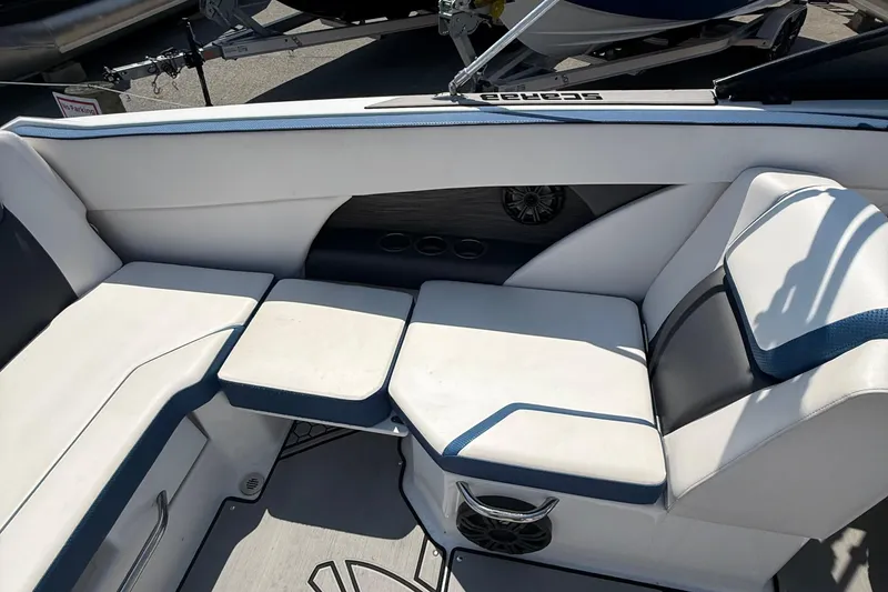 Slide: The Image of Interior seating of 2020 Scarab 255 Open ID boat, featuring white and blue upholstery. - 16