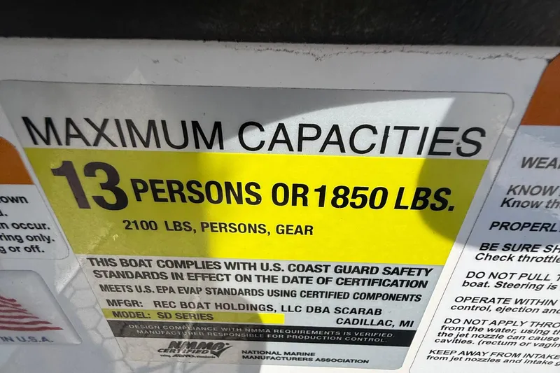 Slide: The Image of Maximum capacity label for 2020 Scarab 255 Open ID: 13 persons or 1850 lbs. - 20