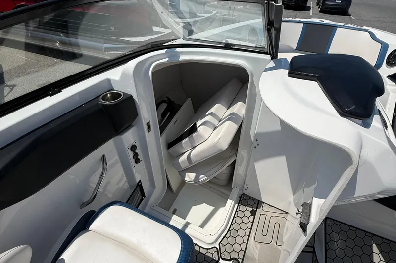 Slide: The Image of 2020 Scarab 255 Open ID boat interior with seating and storage area. - 14