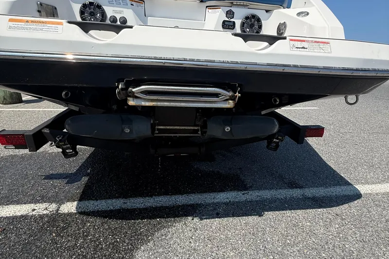 Slide: The Image of Rear view of a 2020 Scarab 255 Open ID boat on a trailer. - 18