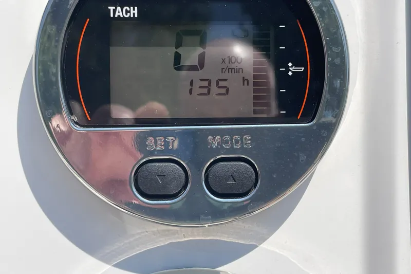 Slide: The Image of Tachometer display on 2018 Robalo R180 Center Console showing 135 hours. - 4