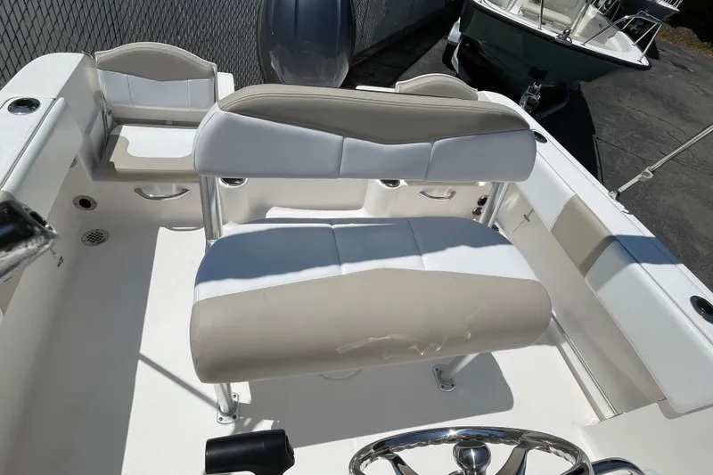 Slide: The Image of 2018 Robalo R180 Center Console boat interior with seating and steering wheel. - 5