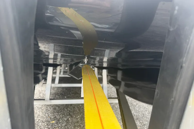 Slide: The Image of Yellow strap securing Skuta 24 Cat 2027 boat hull on trailer. - 3