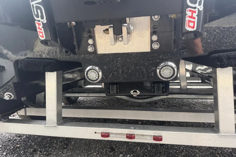 Slide: The Image of Close-up of 2027 Skuta 24 Cat boat trailer hitch and lighting system. - 17