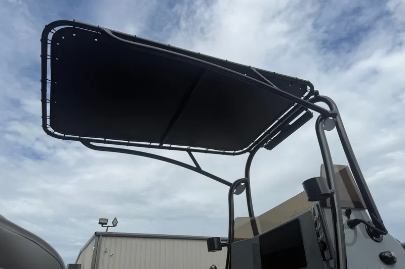 Slide: The Image of Skuta 24 Cat 2027 model with a sleek black canopy against a cloudy sky. - 8