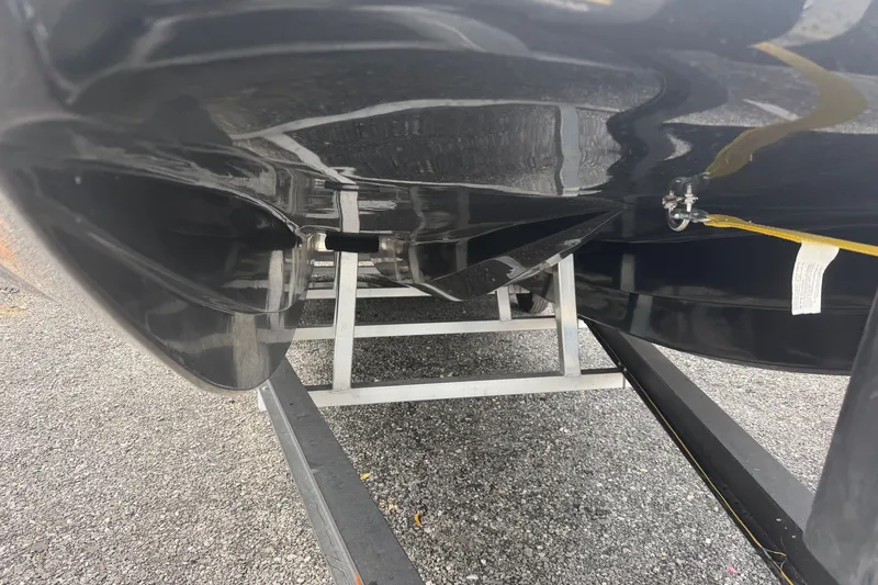 Slide: The Image of Underside view of a 2027 Skuta 24 Cat boat on a trailer. - 4