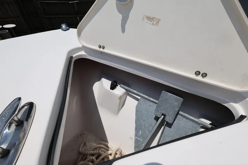 Slide: The Image of Anchor compartment of 2015 Sea Fox 286 Commander boat with rope and anchor. - 17