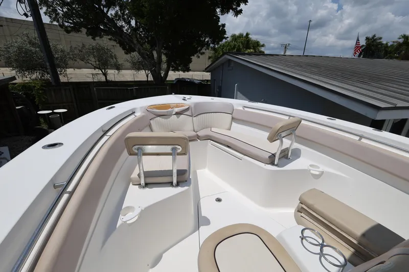 Slide: The Image of 2015 Sea Fox 286 Commander boat interior with cushioned seating and cup holders. - 15
