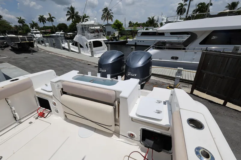 Slide: The Image of 2015 Sea Fox 286 Commander boat docked, featuring dual 250 horsepower engines. - 22