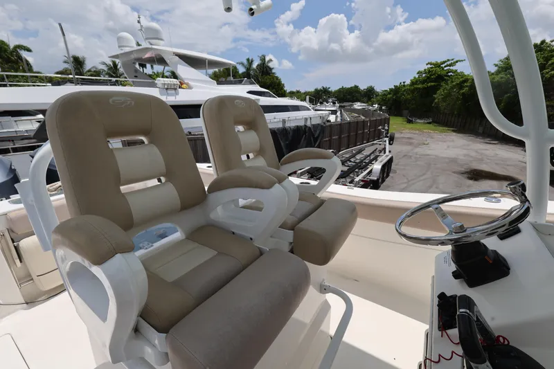 Slide: The Image of 2015 Sea Fox 286 Commander boat interior with dual helm seats and steering wheel. - 11