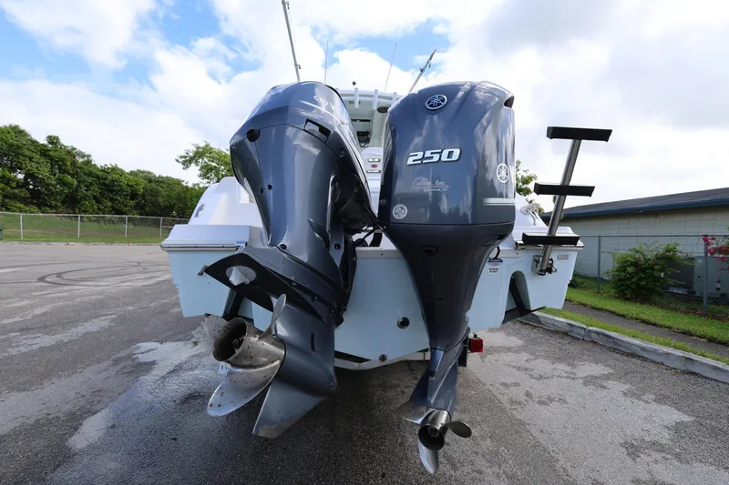 Slide: The Image of 2015 Sea Fox 286 Commander with dual Yamaha 250 outboard engines, parked outdoors. - 7