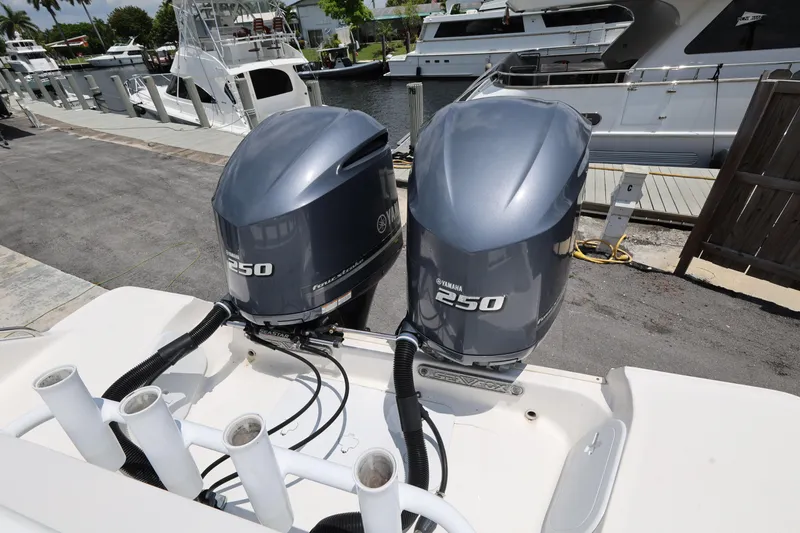 Slide: The Image of Twin Yamaha 250 outboard engines on a 2015 Sea Fox 286 Commander boat docked at a marina. - 23