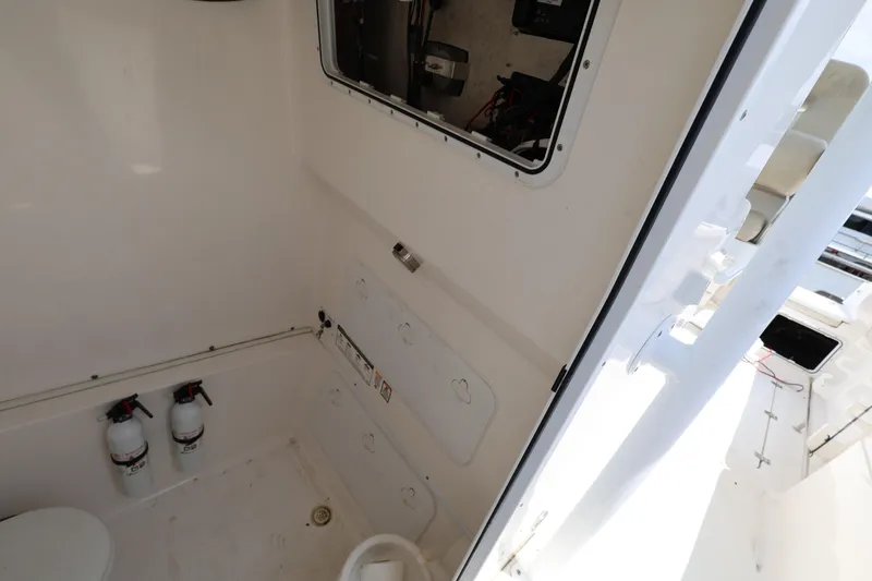 Slide: The Image of Interior of 2015 Sea Fox 286 Commander boat, featuring storage and safety equipment. - 21