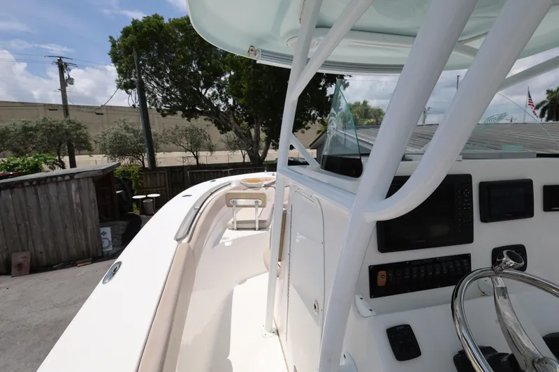 Slide: The Image of 2015 Sea Fox 286 Commander boat interior with steering wheel and control panel. - 14