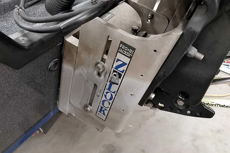 Slide: The Image of Close-up of a 2015 Triton 19 TrX boat's Pro Hi Jacker plate. - 17