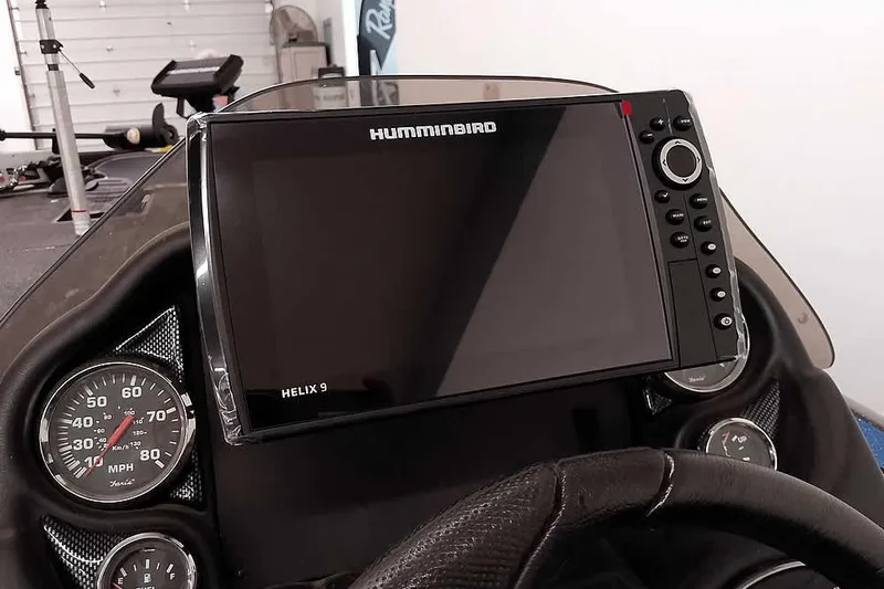 Slide: The Image of Dashboard of a 2015 Triton 19 TrX with Humminbird Helix 9 fishfinder. - 30