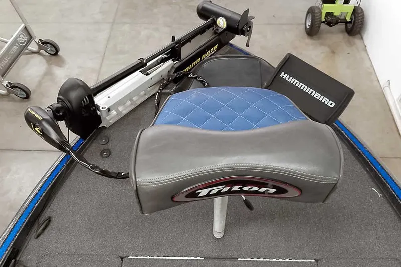 Slide: The Image of 2015 Triton 19 TrX boat seat with Hummingbird electronics and trolling motor. - 22