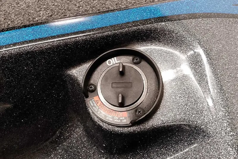 Slide: The Image of Oil cap on 2015 Triton 19 TrX boat with metallic finish. - 19