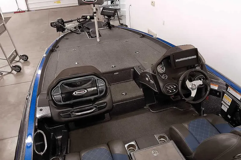 Slide: The Image of 2015 Triton 19 TrX boat interior with steering console and Humminbird electronics. - 20