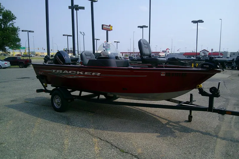 Slide: The Image of 2024 Tracker Pro Guide V-16 SC boat on trailer in parking lot. - 3