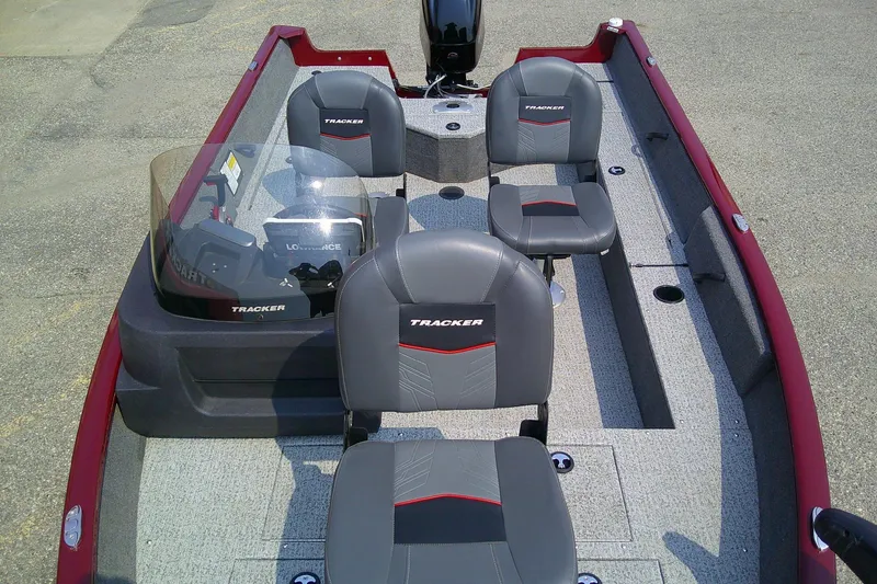 Slide: The Image of 2024 Tracker Pro Guide V-16 SC boat interior with seating and steering console. - 9