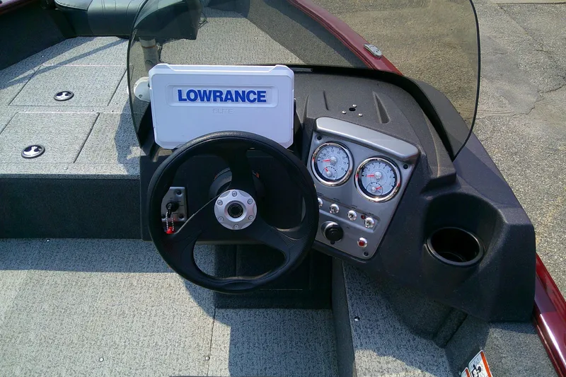 Slide: The Image of 2024 Tracker Pro Guide V-16 SC boat dashboard with Lowrance Elite fishfinder and gauges. - 6