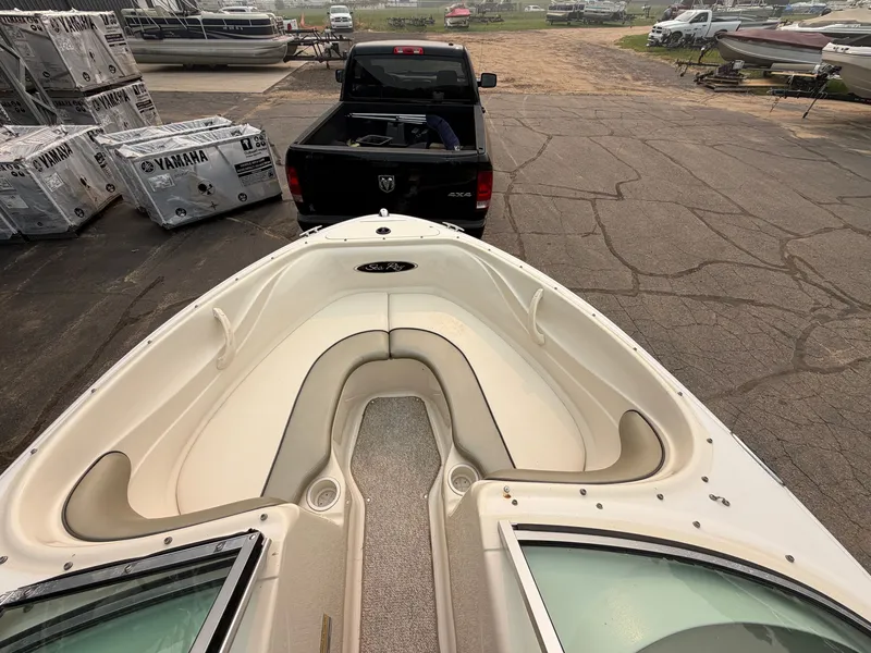 Slide: The Image of The image shows the bow layout of a 2005 Sea Ray 185 Sport boat on a trailer. - 3