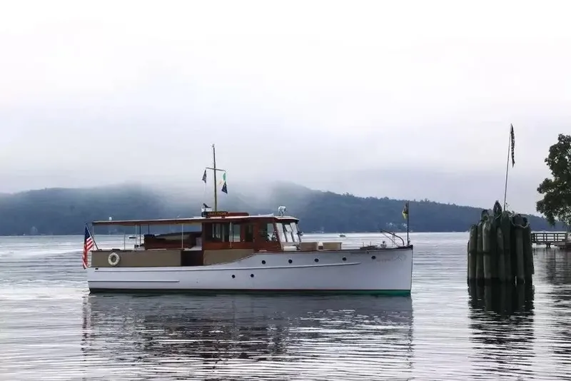 The Image of A classic 43-foot cruiser by Hubert Johnson from 1926, anchored on calm waters. - 1