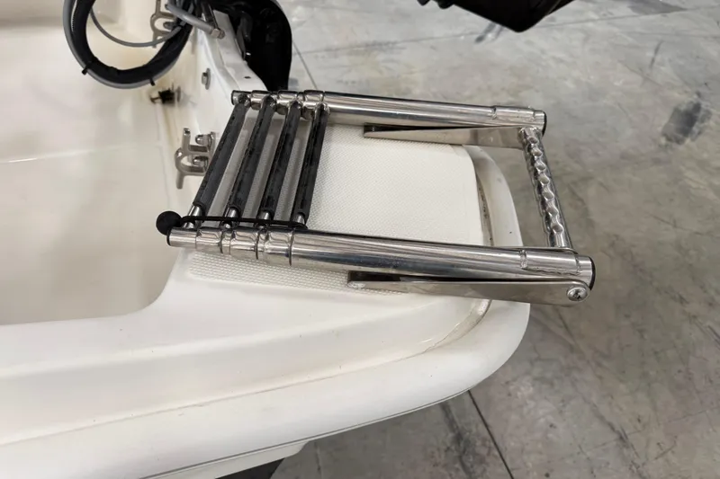 Slide: The Image of Stainless steel ladder on 2021 Boston Whaler 130 Super Sport boat. - 9