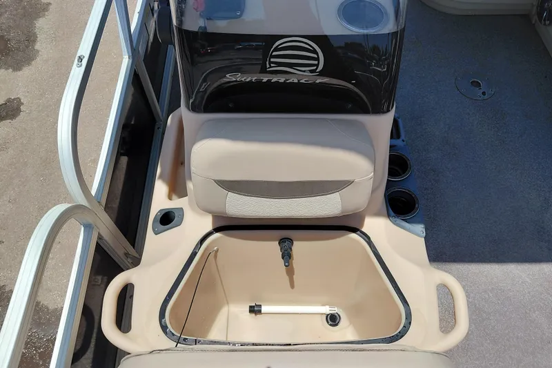 Slide: The Image of 2015 Sun Tracker Bass Buggy 18 DLX boat interior with seating and storage compartment. - 28