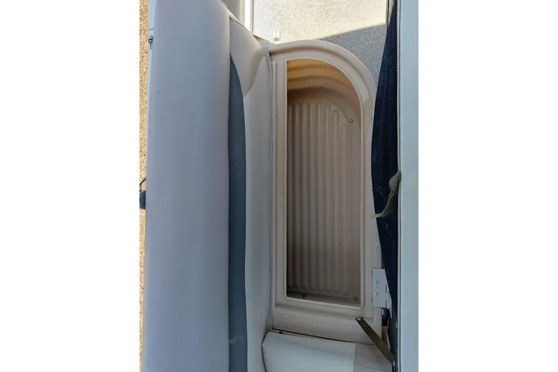 Slide: The Image of 2015 Sun Tracker Bass Buggy 18 DLX storage compartment interior view. - 30