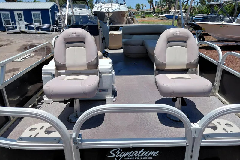 Slide: The Image of 2015 Sun Tracker Bass Buggy 18 DLX pontoon boat with comfortable seating and spacious deck. - 8