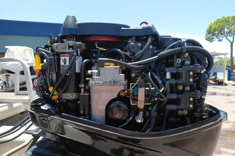 Slide: The Image of Close-up of a Mercury outboard motor on a 2015 Sun Tracker Bass Buggy 18 DLX. - 33