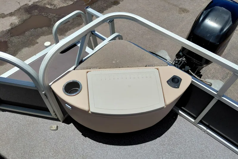 Slide: The Image of 2015 Sun Tracker Bass Buggy 18 DLX pontoon boat with motor and fishing station. - 22