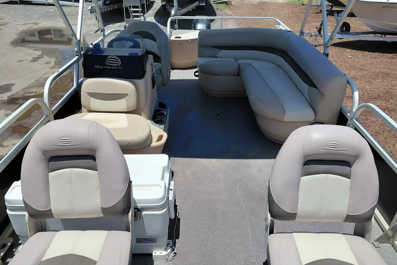 Slide: The Image of 2015 Sun Tracker Bass Buggy 18 DLX pontoon boat interior with seating and helm. - 9