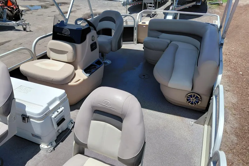 Slide: The Image of 2015 Sun Tracker Bass Buggy 18 DLX pontoon boat interior with seating and console. - 11