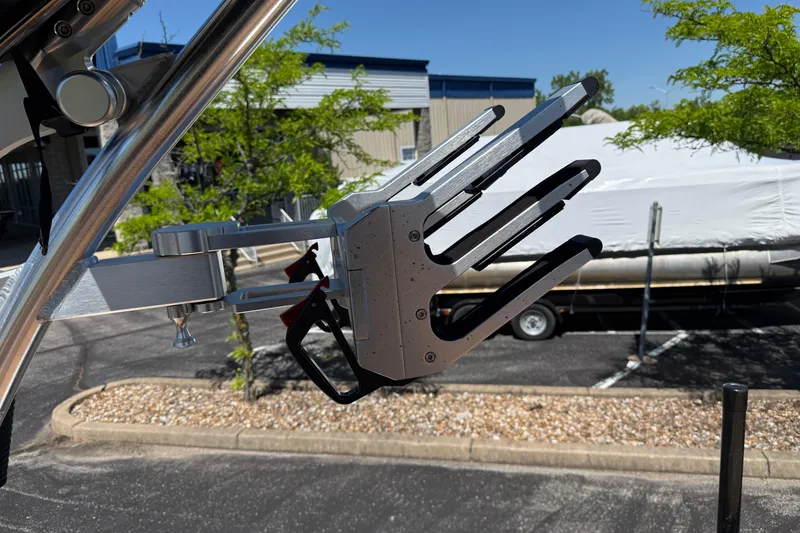 Slide: The Image of MasterCraft XT21 2021 wakeboard rack in a sunny outdoor setting. - 20
